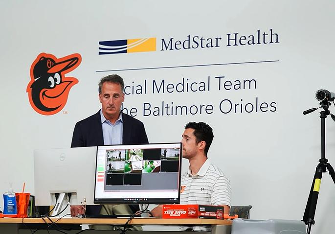 Dr Sean Curtin looks at a computer screen with data from the MedStar Sports Medicine pitching lab in Bel Air, Maryland.