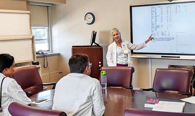 A female medical professor teaches in a classroom setting at MedStar Health.