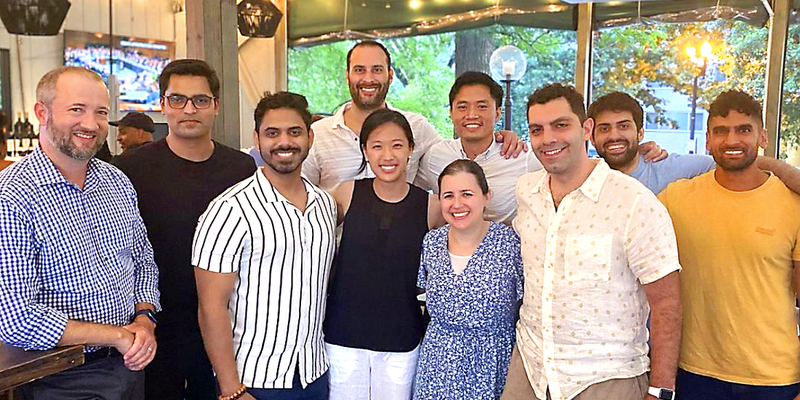 Current fellows from the Pulmonary Critical Care Medicine Fellowship stand outside to pose for a photo.
