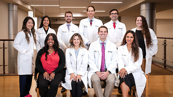 A group of residents and faculty from the Radiology Oncology Residency Program at MGUH poses for a photo outdoors.