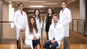 A group of residents from the Radiology Oncology Residency Program at MGUH poses for a photo outdoors.