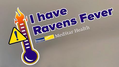 A MedStar Health associate shows excitement for the Ravens AFC Playoff game this weekend in Baltimore.