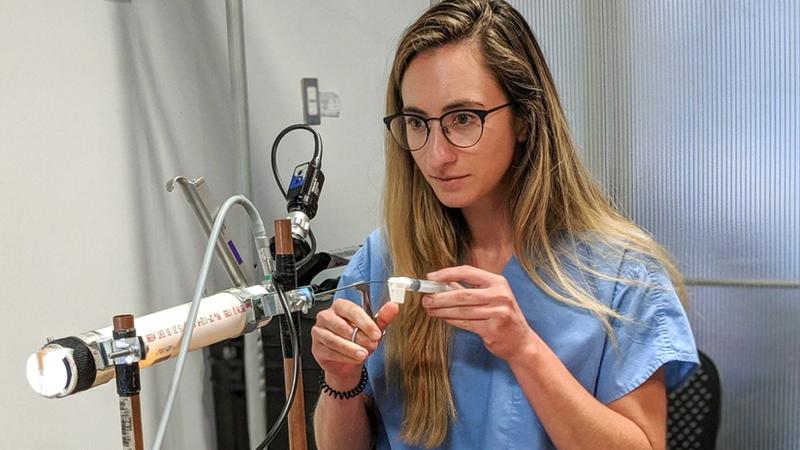 A student in MedStar Health's Otolaryngology Head and Neck Surgery Residency program works in a classroom.