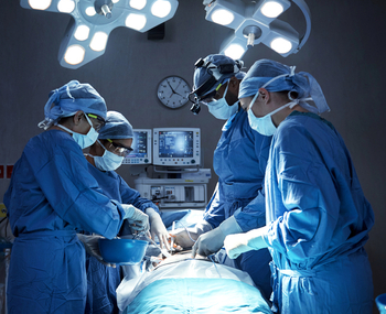 A team of surgeons in an operating room.