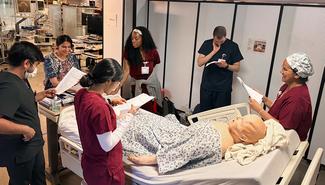 A group of residents completes a training activity at the Simulation Training and Education Lab at MedStar Health.