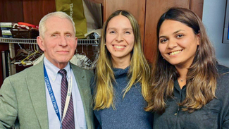 Dr. Anthony Fauci poses for a photo with residents from MedStar Health.