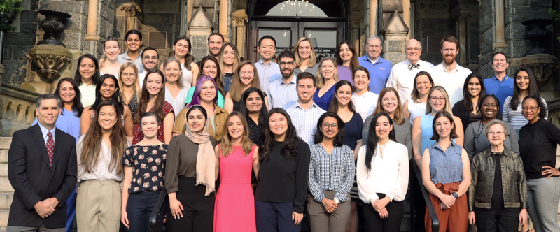 Group photo of the current class of residents in the Pediatric Residency Program at MedStar Georgetown University Hospital standing on the steps of a large stone building.