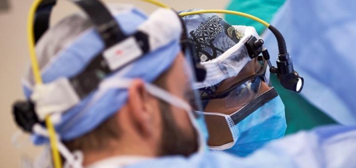 Doctors perform eye surgery in an operating room at MedStar Health.