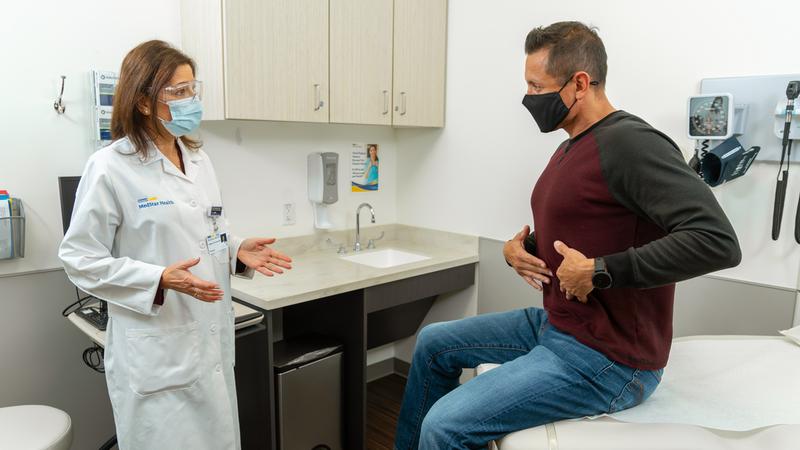 A patient talks to a MedStar Health doctor about abdominal pain.