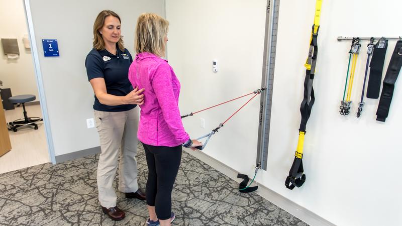 A physical therapist works with a patient at MedStar Health.