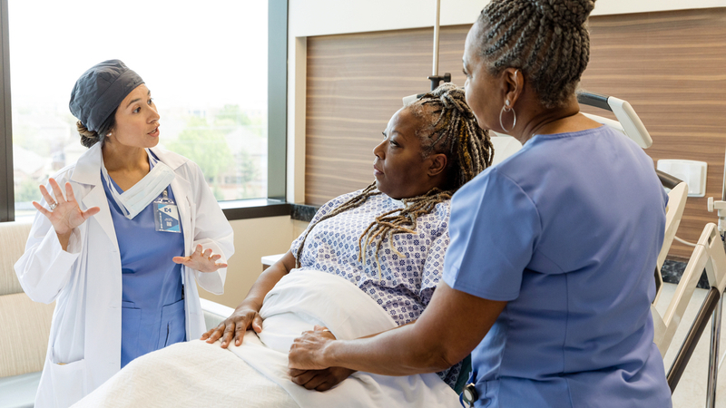 Dr James Fitzgerald talks with a patient during an office visit at MedStar Health.