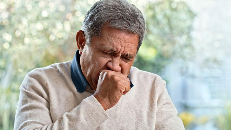 A man coughing.