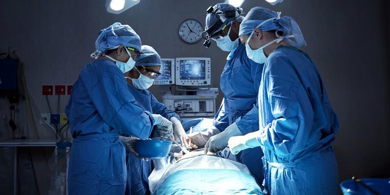 A team of surgeons in an operating room.