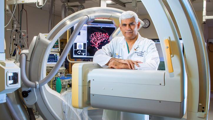 Dr Arshad Khan stands in an interventional radiology lab at MedStar Health.