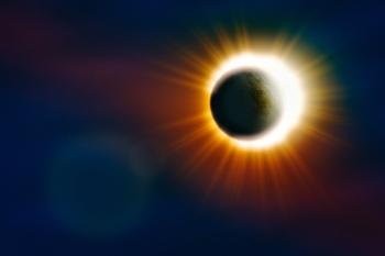 The moon passing in front of the sun on during a solar eclipse.