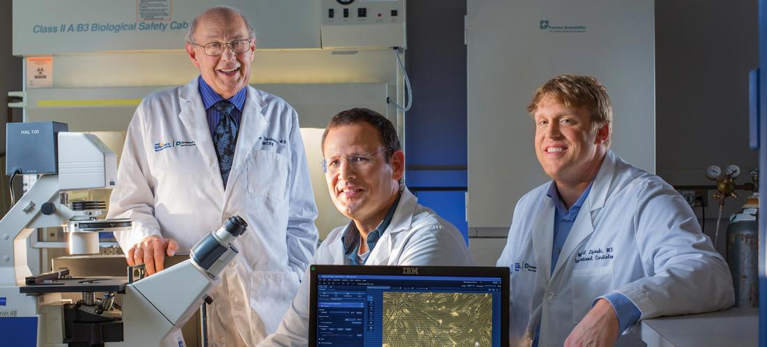 3 doctors pose for a photo in the stem cell lab at MedStar Washington Hospital Center.