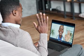 A male african-american patient talks on conference video call to female african doctor. Virtual therapist consulting young man during online appointment on laptop at home. Telemedicine chat, telehealth meeting