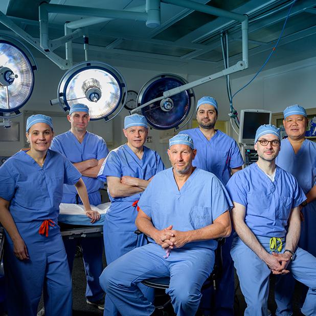 A team of transplant surgeons from MedStar Georgetown University Hospital pose for a group photo in the operating room.