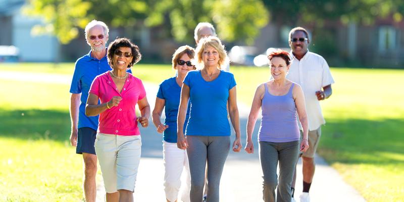 Group of older adults walking for fitness