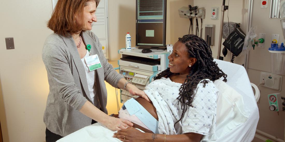 Loral Patchen, MedStar Health midwife, vists with a patient in her hospital room.